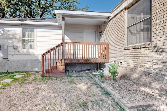 doorway to property featuring a wooden deck