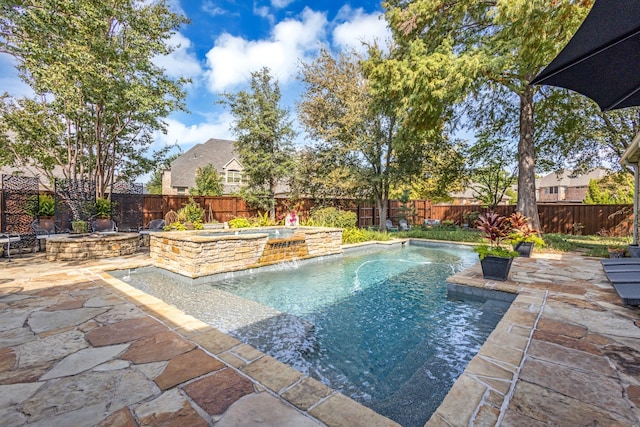 view of swimming pool featuring a patio, an in ground hot tub, and pool water feature