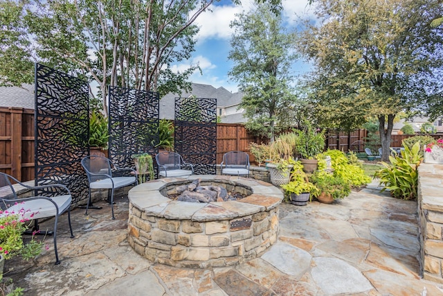 view of patio / terrace with a fire pit