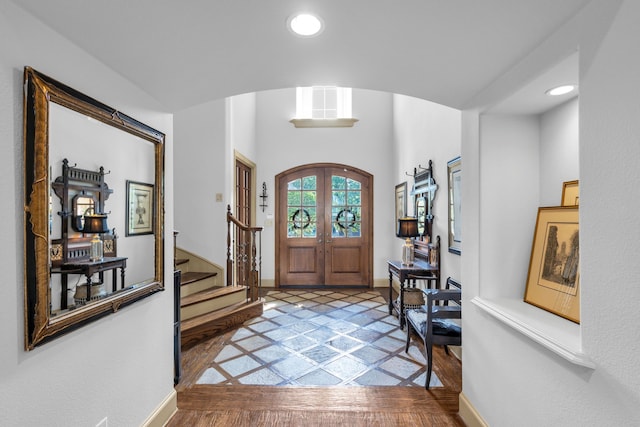 entryway featuring french doors and hardwood / wood-style floors