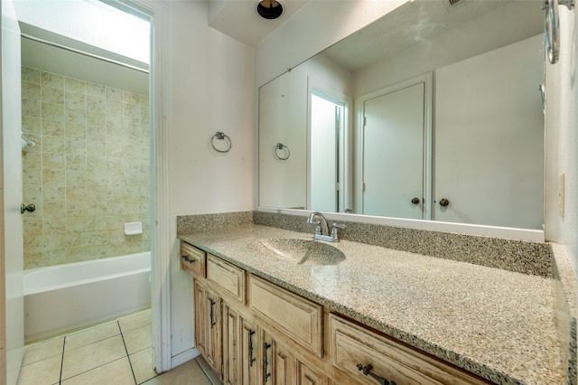 bathroom with vanity, tiled shower / bath combo, and tile patterned floors