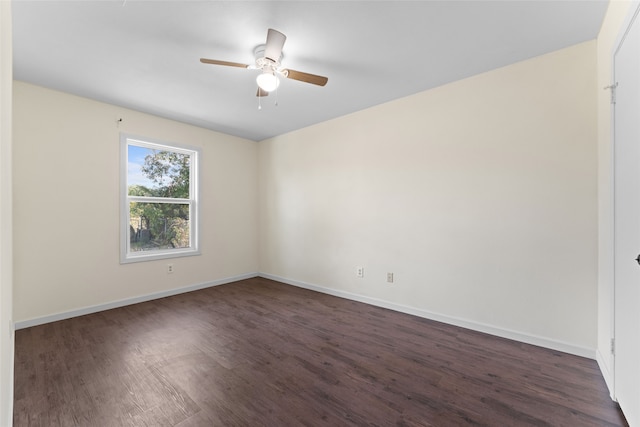 unfurnished room with dark wood-type flooring and ceiling fan