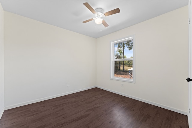 unfurnished room featuring dark hardwood / wood-style floors and ceiling fan