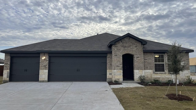 view of front of property with a garage