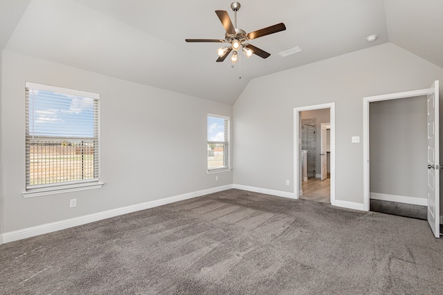 unfurnished bedroom with multiple windows, carpet, lofted ceiling, and ceiling fan