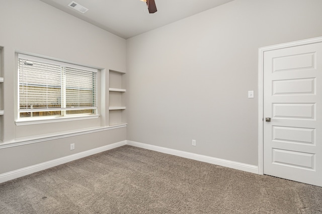 carpeted empty room with ceiling fan