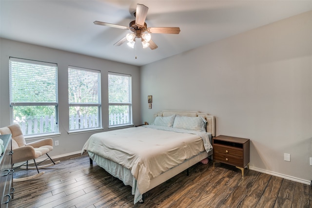 bedroom featuring ceiling fan and dark wood-type flooring