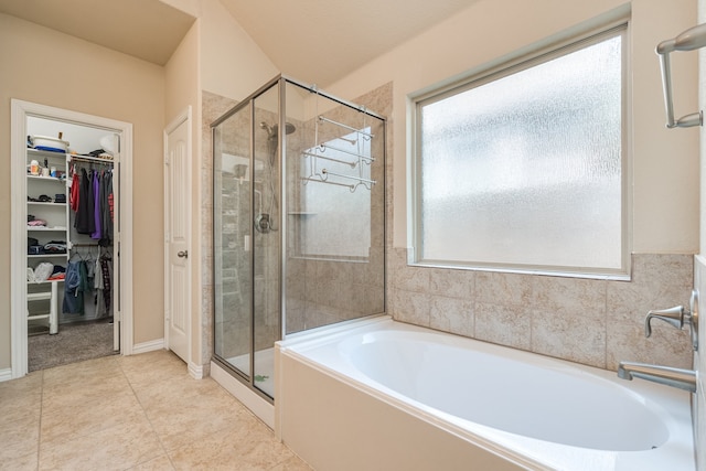 bathroom featuring shower with separate bathtub and tile patterned floors