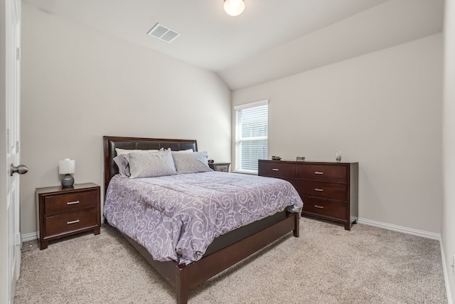 carpeted bedroom featuring lofted ceiling