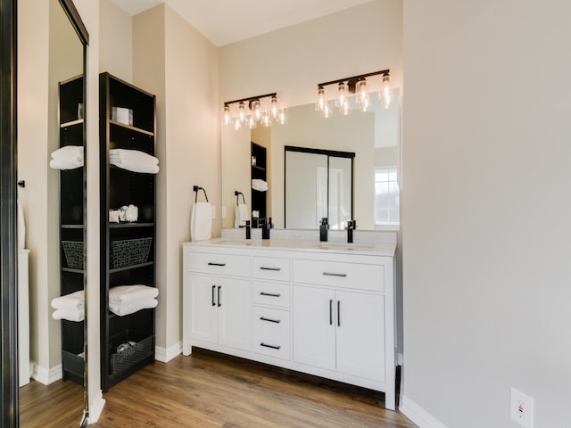 bathroom featuring vanity and hardwood / wood-style floors