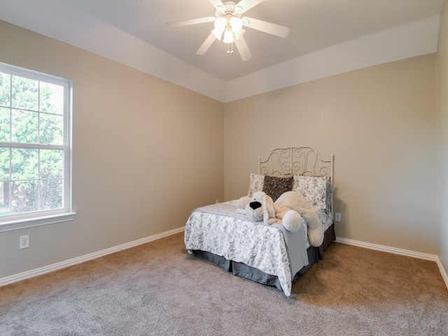 bedroom with light carpet and ceiling fan