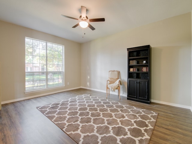 sitting room featuring ceiling fan and hardwood / wood-style floors