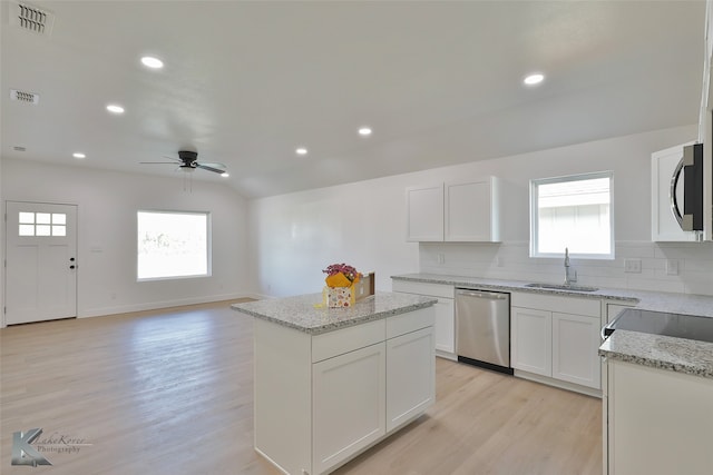 kitchen featuring white cabinetry, a healthy amount of sunlight, and stainless steel appliances