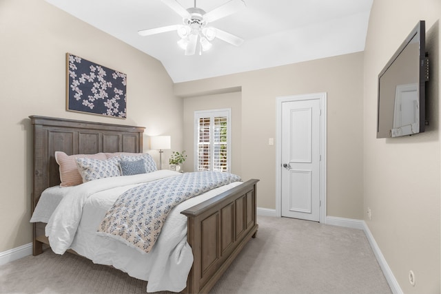 bedroom featuring light colored carpet, ceiling fan, and vaulted ceiling