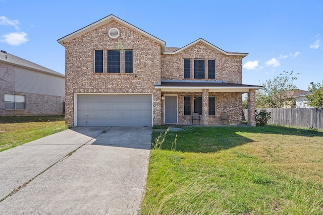 view of property with a front yard and a garage