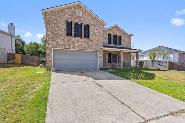 front facade featuring a front yard and a garage