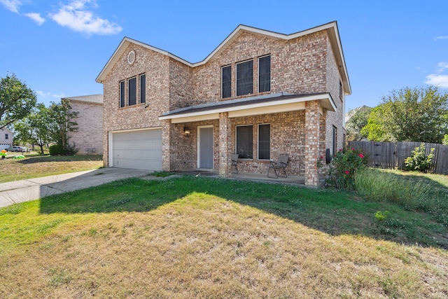 view of front of property with a garage and a front lawn