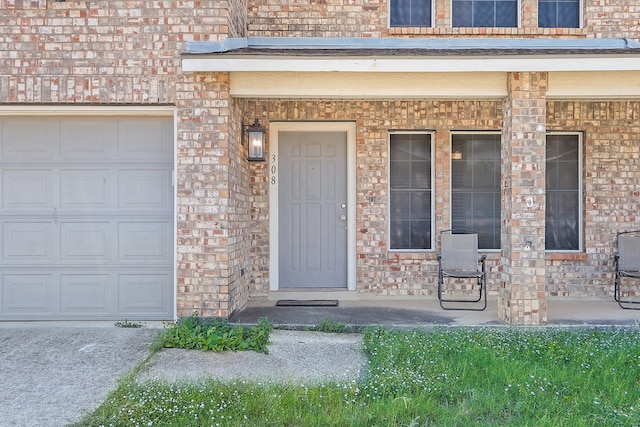 view of exterior entry featuring a garage