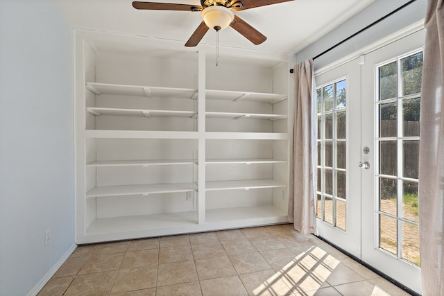 interior space with french doors, ceiling fan, light tile patterned floors, and a wealth of natural light