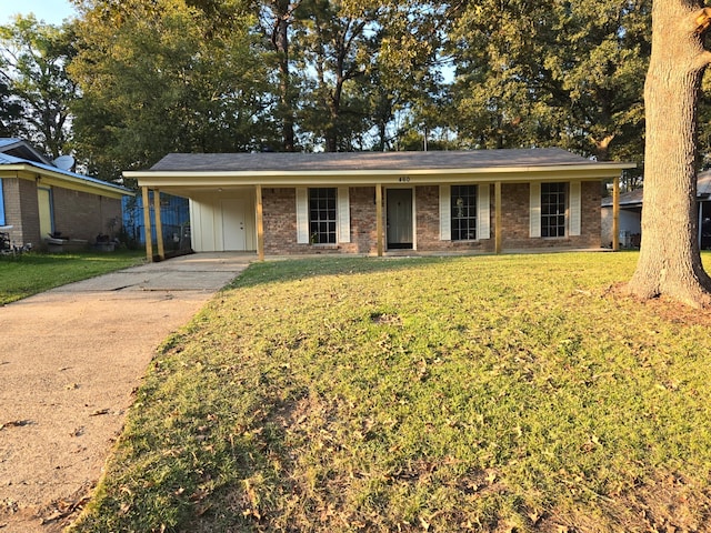 ranch-style house featuring a front yard and a carport