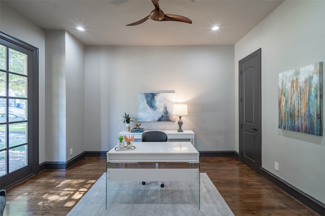 office space with dark wood-type flooring and ceiling fan