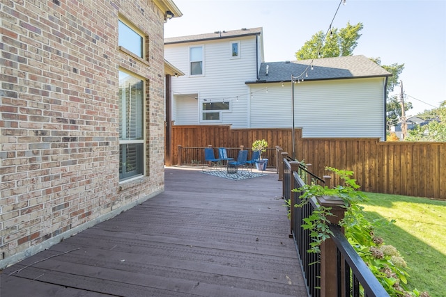 deck featuring an outdoor hangout area and a lawn