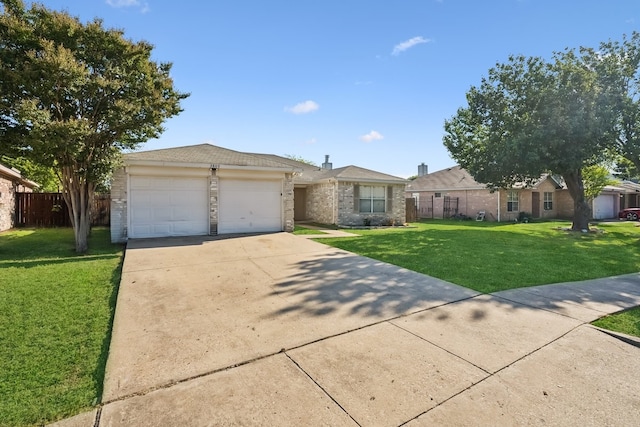 ranch-style home featuring a garage and a front lawn