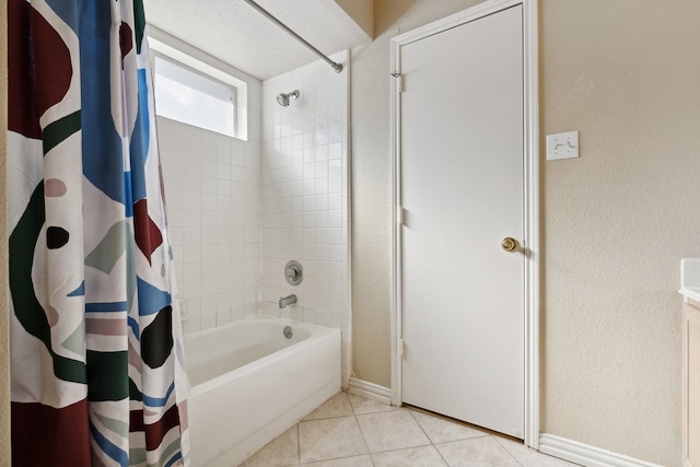 bathroom with tile patterned flooring and shower / bath combo with shower curtain