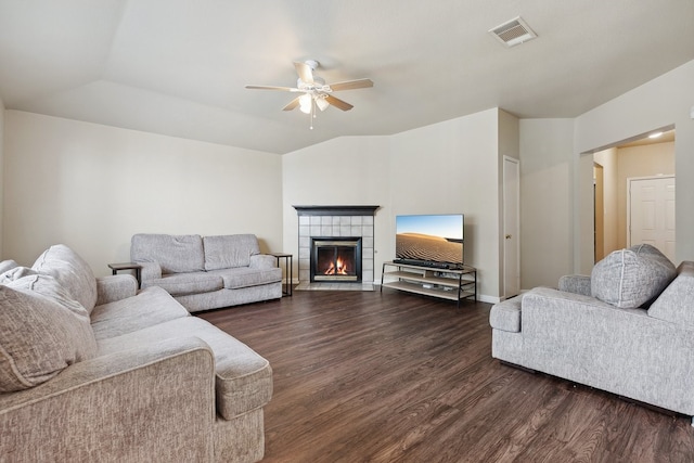 living room with ceiling fan, a fireplace, and dark hardwood / wood-style flooring