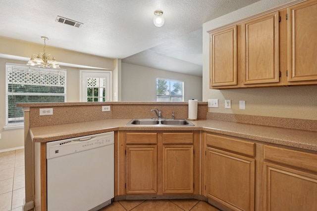 kitchen with dishwasher, a notable chandelier, sink, and a textured ceiling