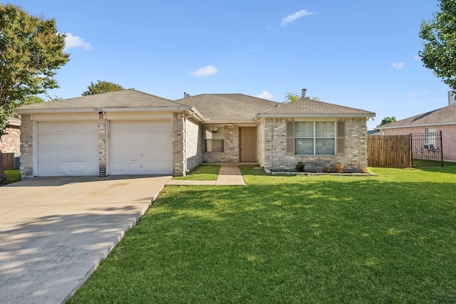 ranch-style home featuring a front yard and a garage