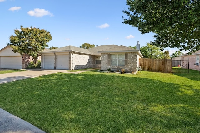 view of front of property featuring a front yard and a garage