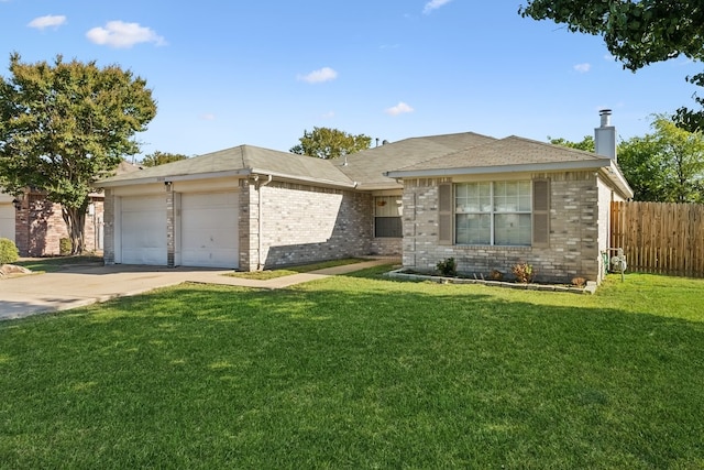 view of front of house with a garage and a front lawn