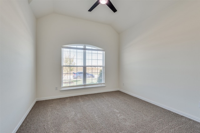 spare room with carpet floors, lofted ceiling, and ceiling fan