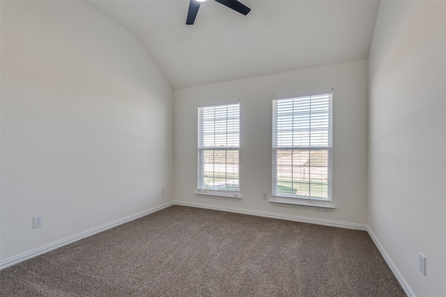 carpeted empty room featuring ceiling fan and lofted ceiling