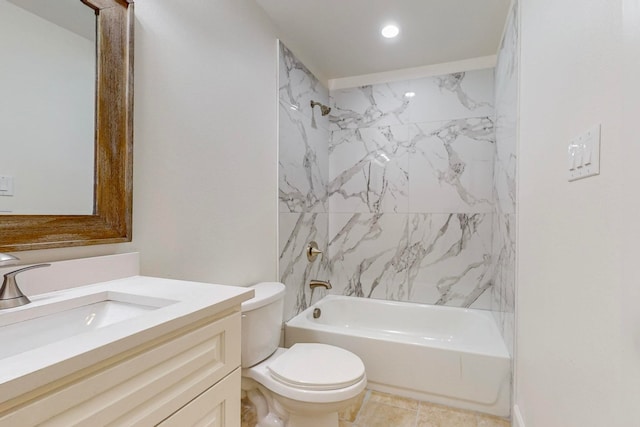 full bathroom with vanity, tiled shower / bath combo, and toilet