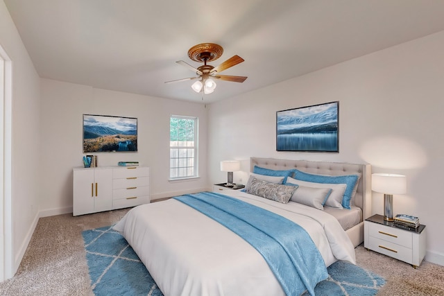 bedroom with ceiling fan and carpet flooring