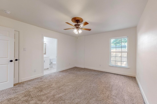 spare room with carpet floors and ceiling fan