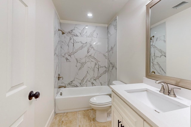 full bathroom with tiled shower / bath, vanity, and toilet