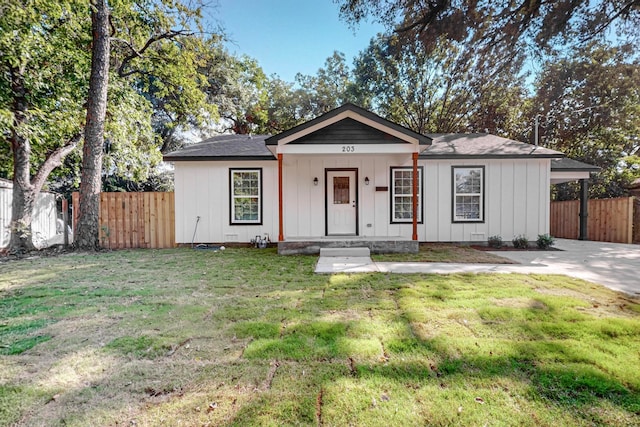 ranch-style home with a porch and a front yard