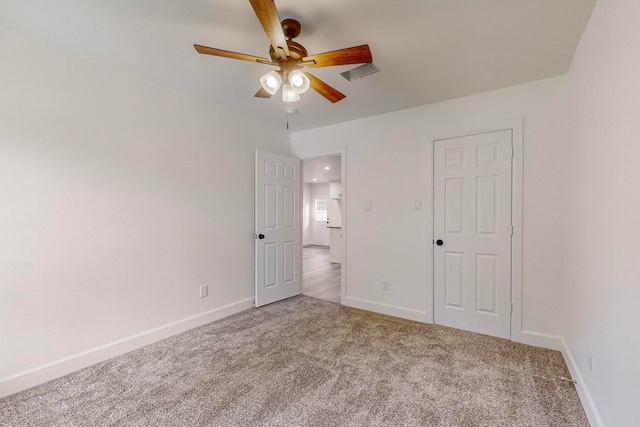 unfurnished bedroom featuring ceiling fan and carpet flooring