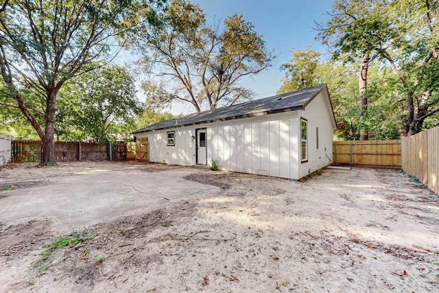 back of property with a patio