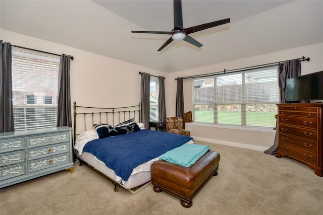 carpeted bedroom with lofted ceiling and ceiling fan