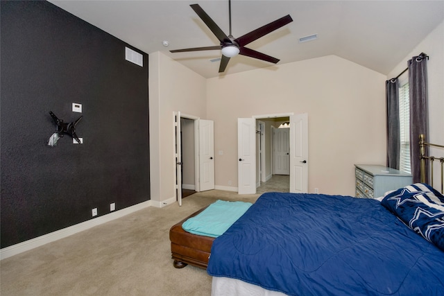 bedroom featuring ceiling fan, light colored carpet, and lofted ceiling