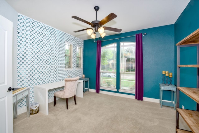 office area with light carpet and ceiling fan