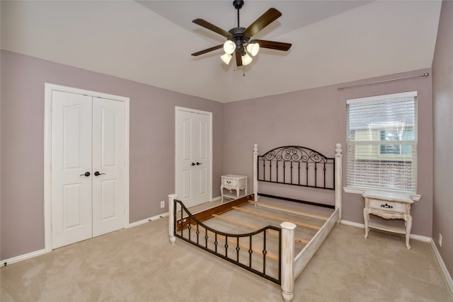 bedroom featuring ceiling fan and light colored carpet