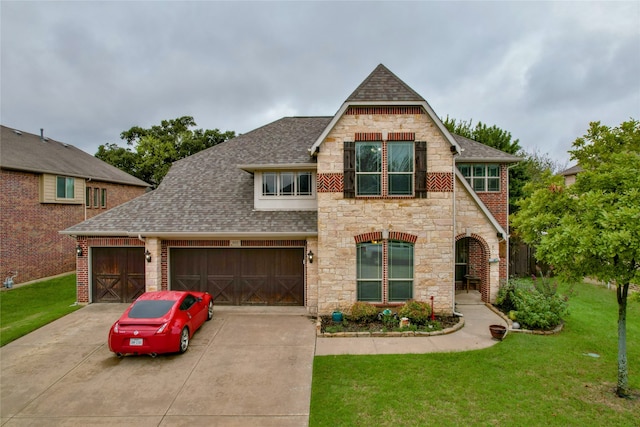 view of front of home featuring a garage and a front lawn