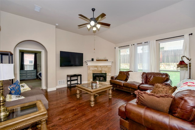 living room featuring ceiling fan, dark hardwood / wood-style floors, vaulted ceiling, and a healthy amount of sunlight