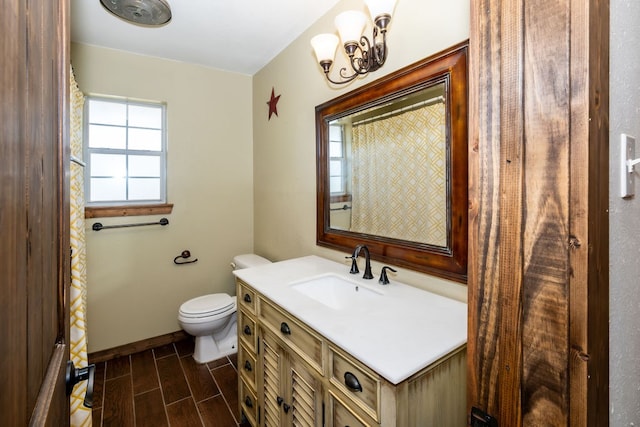 bathroom with toilet and vanity