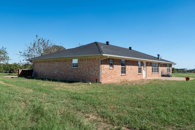 view of home's exterior with a yard